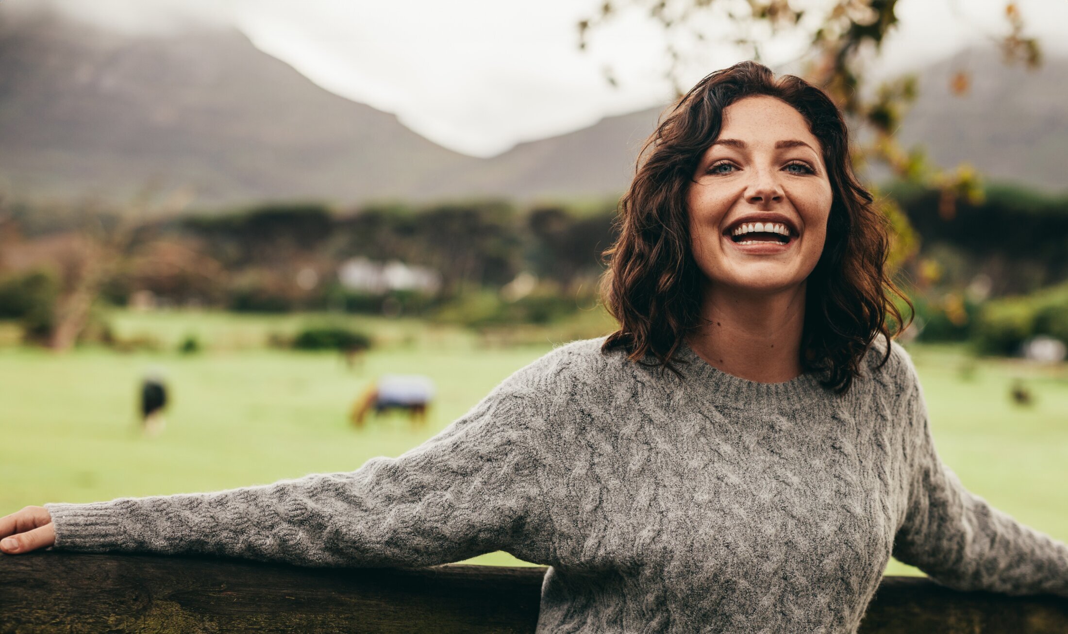 Idaho Falls Plastic Surgery Model wearing a grey sweater